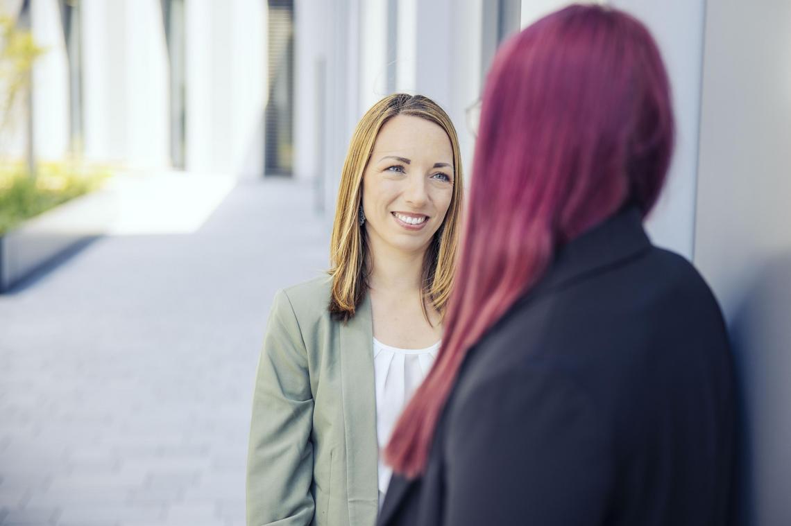 Two women are talking to each other