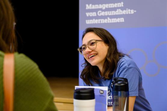 A student gives advice at the information stand
